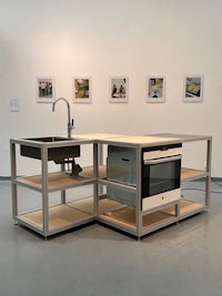 a kitchen with a sink and a stove